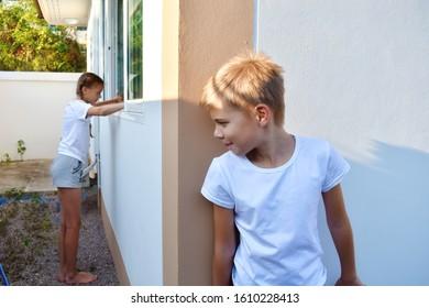 boy-child-peeking-around-corner-260nw-1610228413.jpg