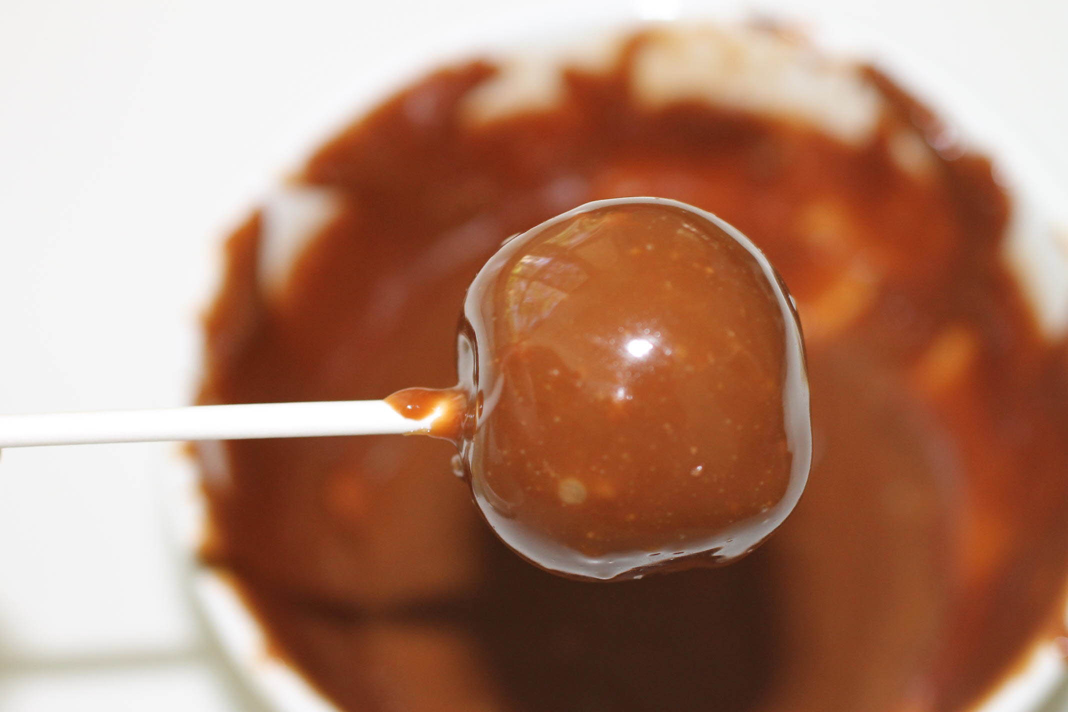 caramel candy oreo cake pops dipped in caramel.jpg