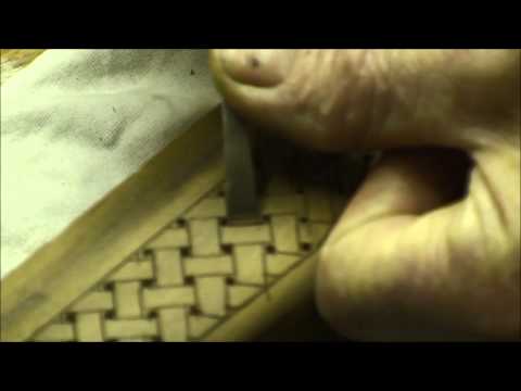 carving a basket weave pattern on a gunstock