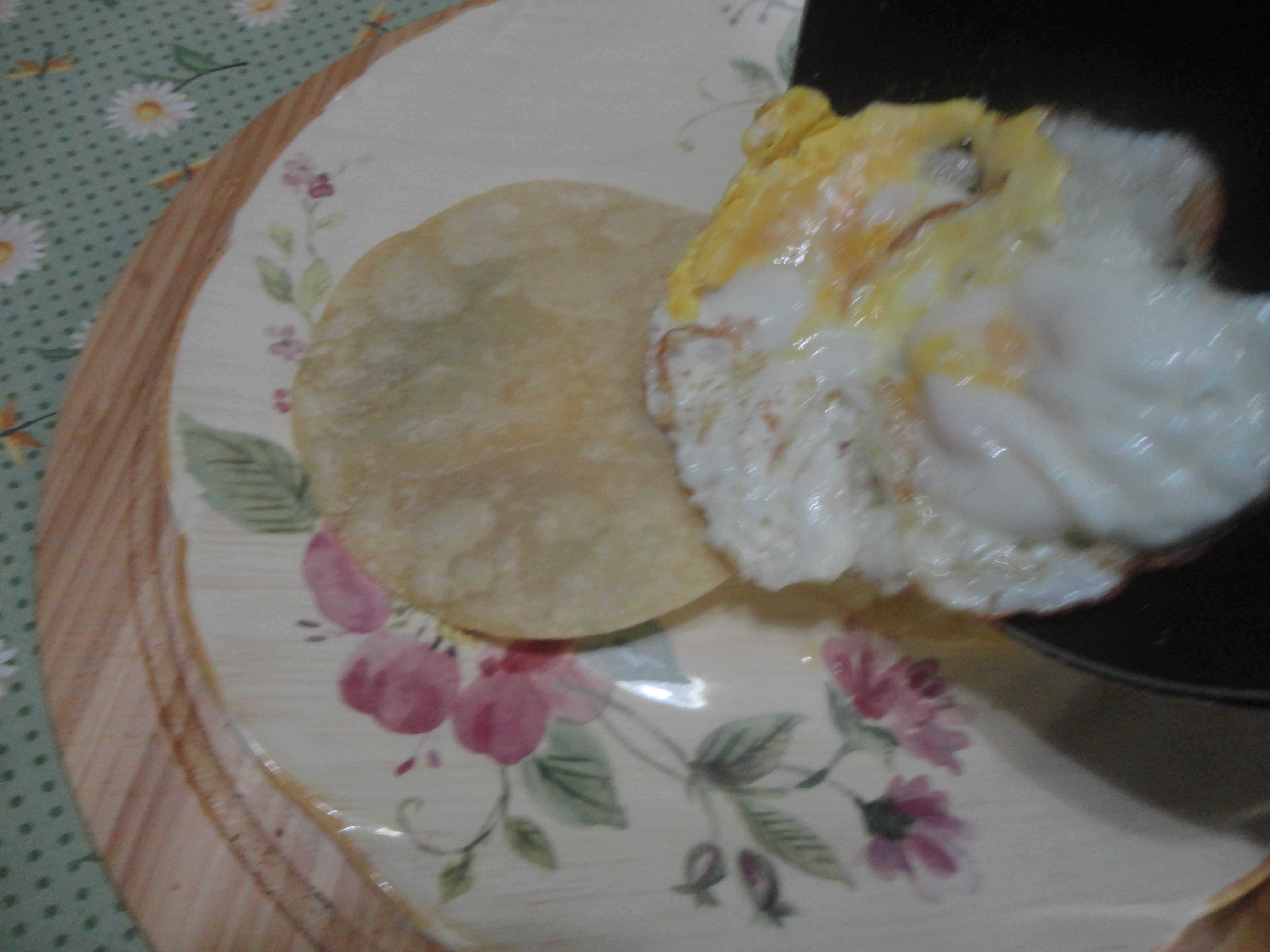 centering cooked eggs over tortillas.JPG