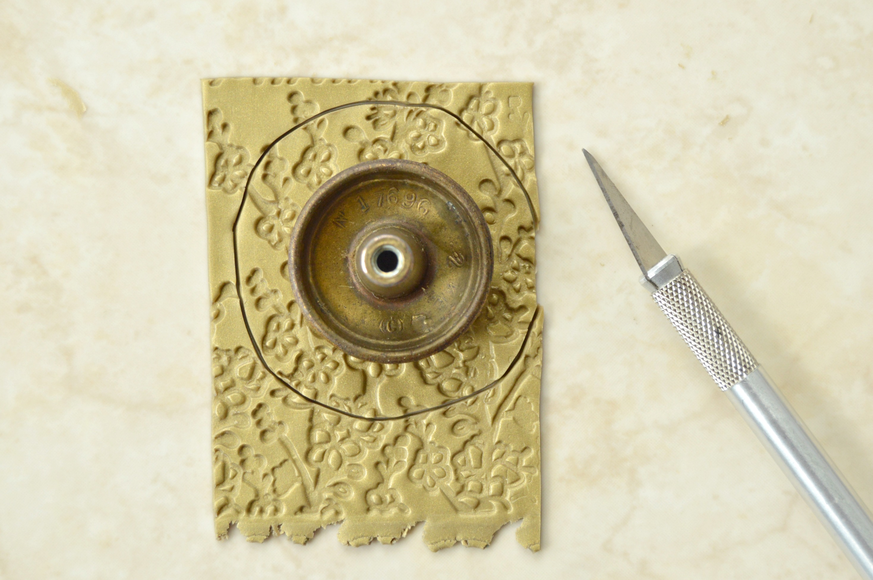 cover the knob with embossed design.jpg