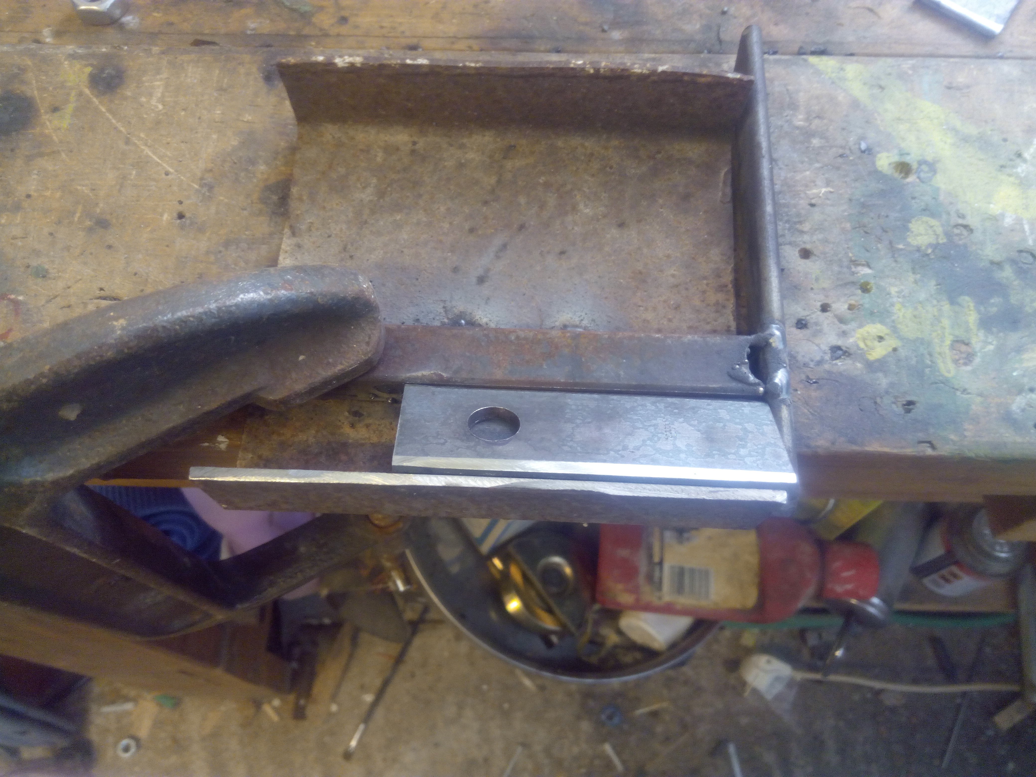 crude jig for putting a bevel on flail edges.jpg