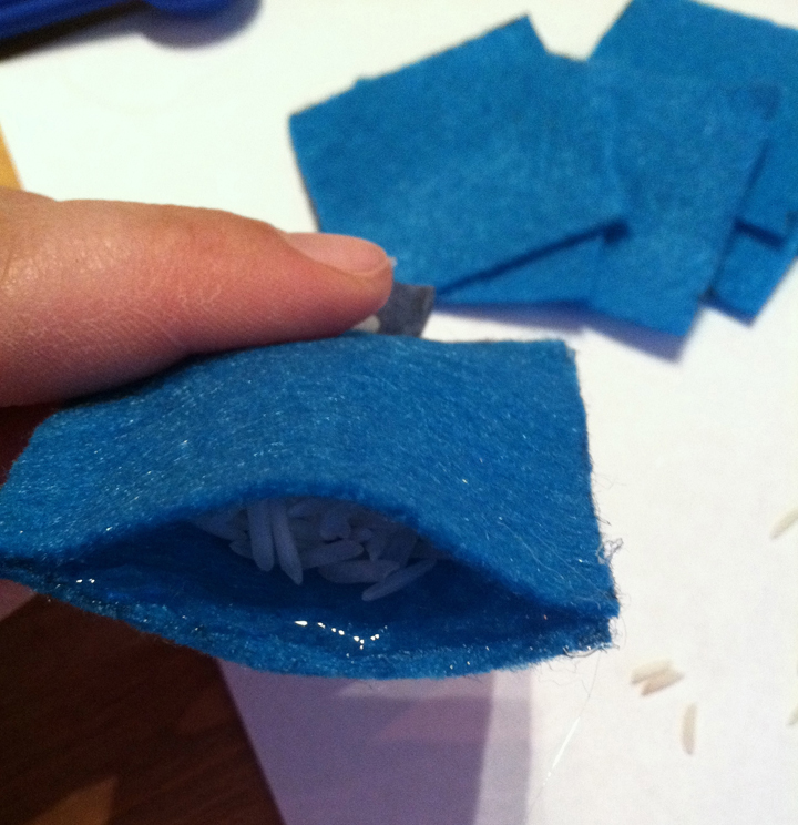 felt pocket with rice being glued shut.jpg