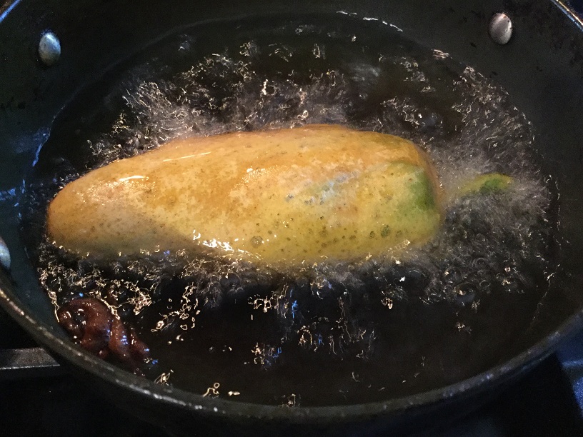 frying mirchi pakoras in oil.jpg