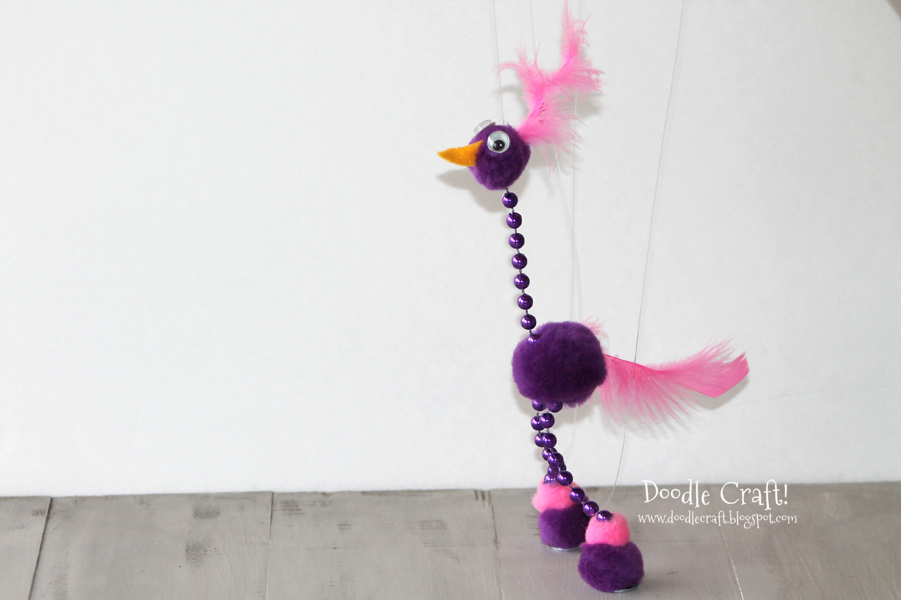 funny cookoo bird marionette puppet strings easy pom pom kids craft.jpg