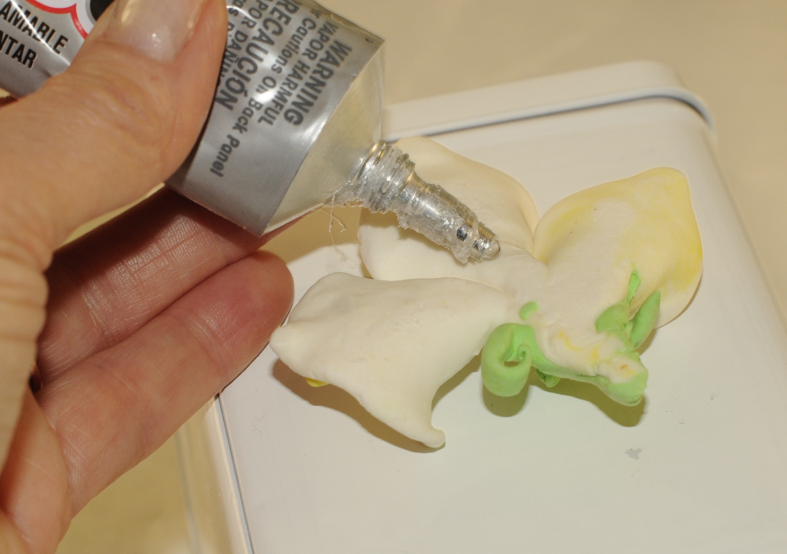 glue air dry clay lily to cannister.JPG
