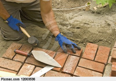 laying-brick-patio-work-bricks-pixmac-picture-12003536.jpg