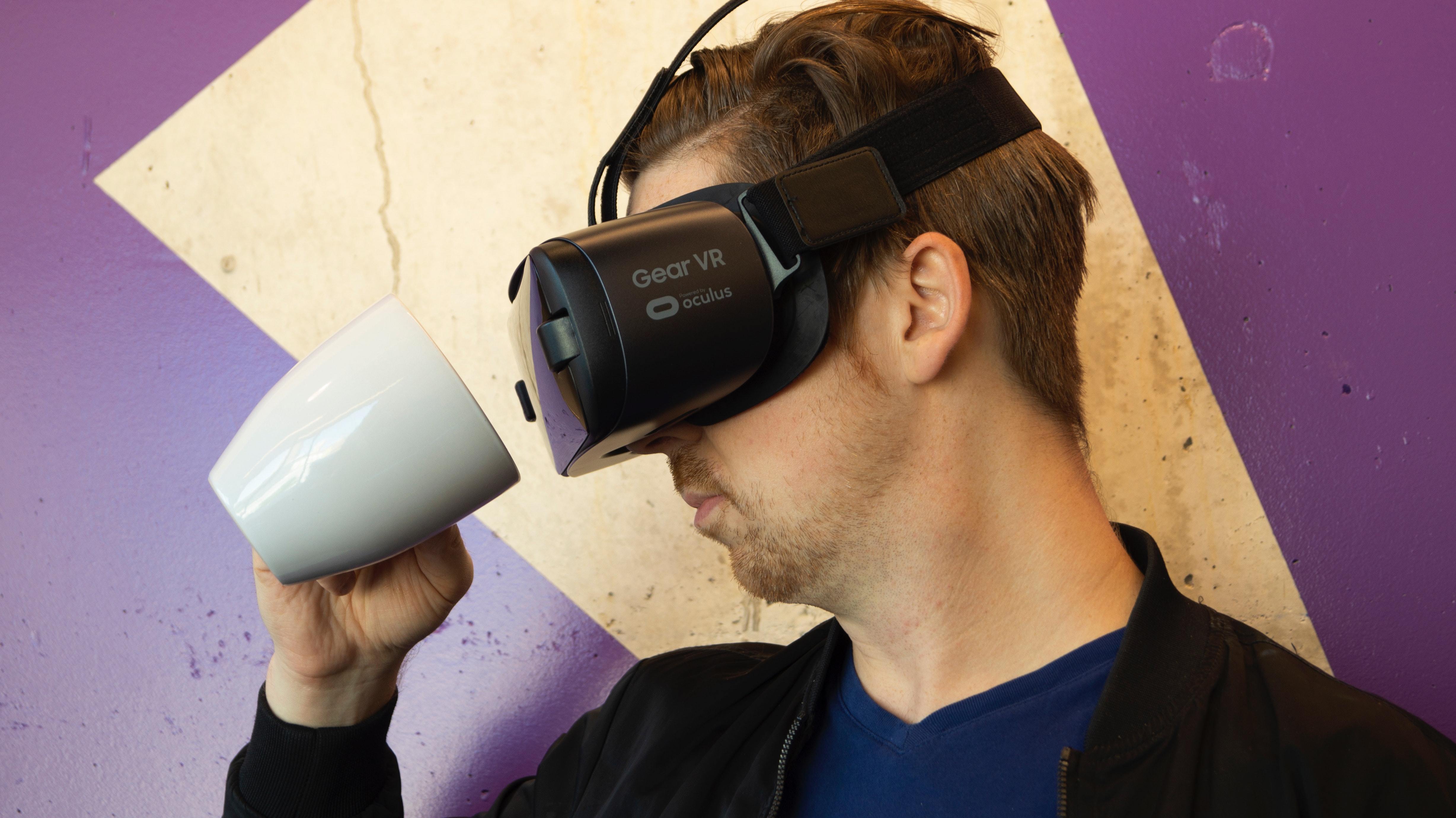 man-wearing-virtual-reality-headset-and-holding-a-mug-1261829.jpg