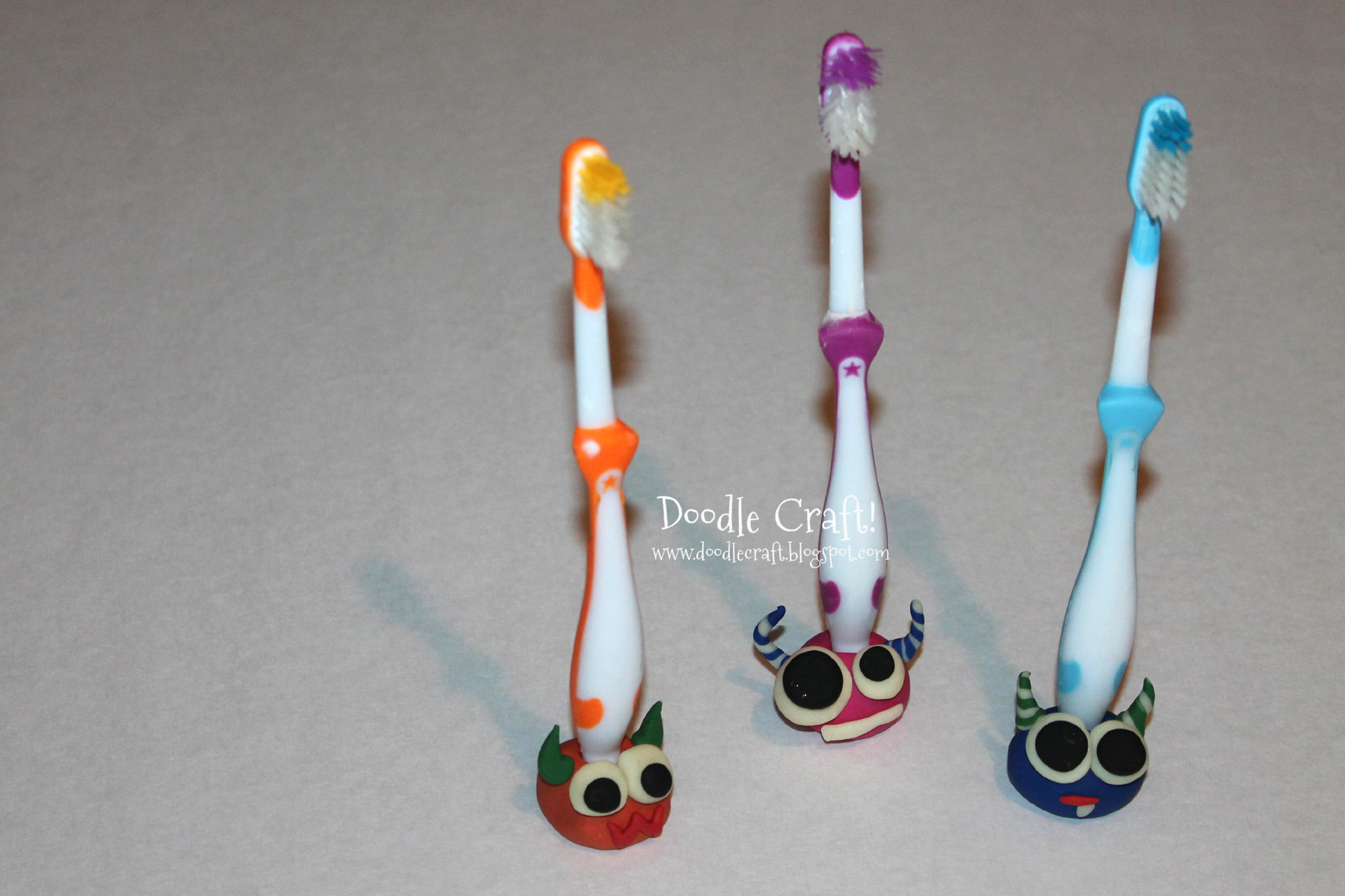 monster toothbrush buddy buddies made by kids out of clay.jpg