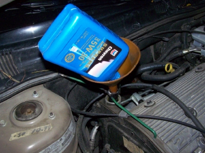 oil filter in funnel wi support.jpg