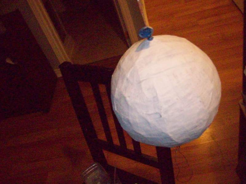 painted white papermache ball.jpg