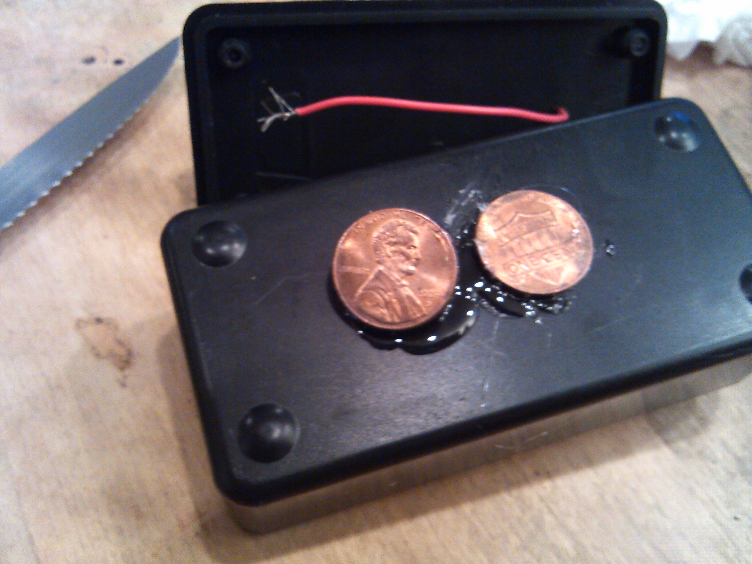 pennies glued in place on bottom.jpg