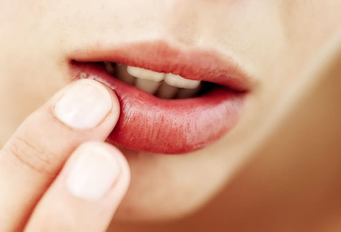 photolibrary_rf_photo_of_woman_touching_lip.jpg