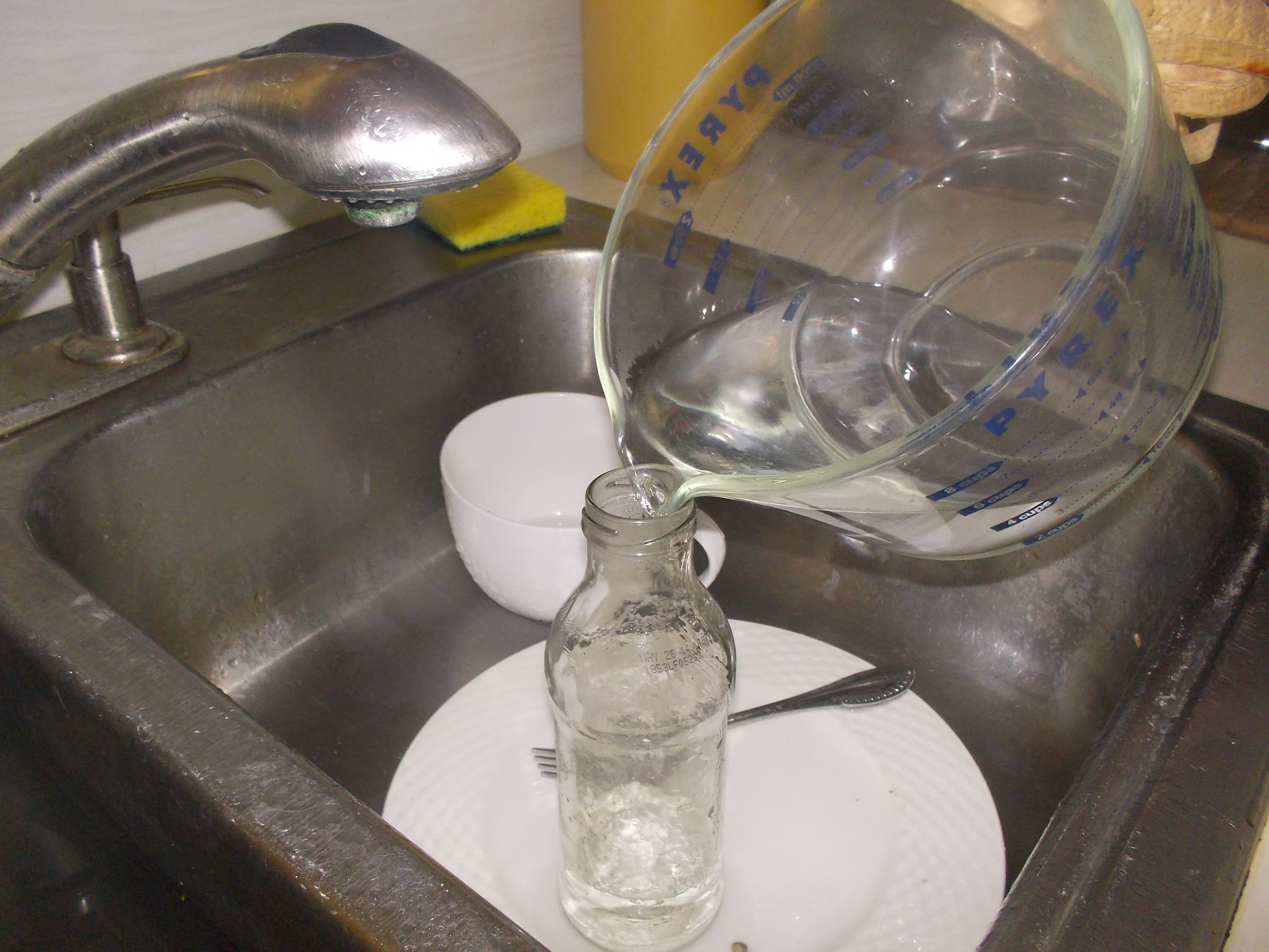 pour boiling water into glass.JPG