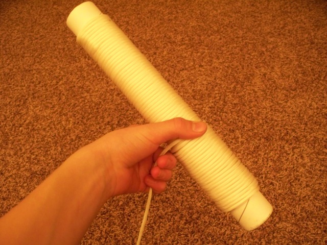 rolling up the white paracord.jpg