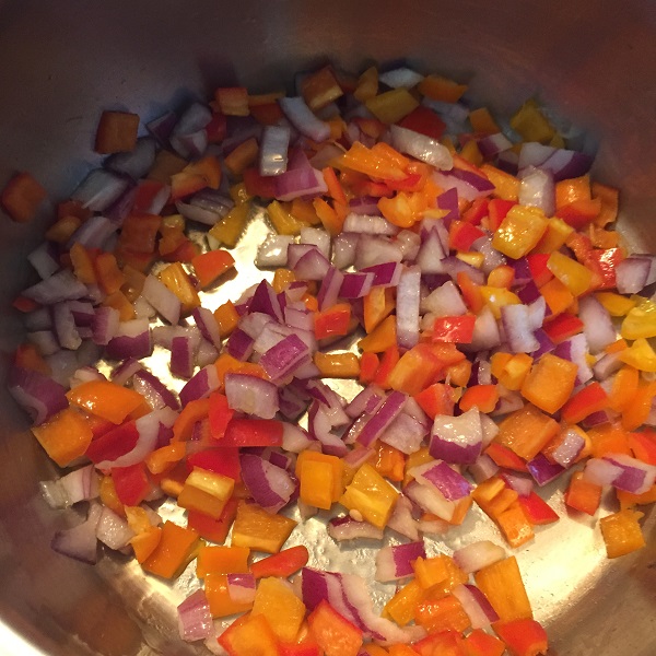 sauteing the onion and sweet peppers.JPG