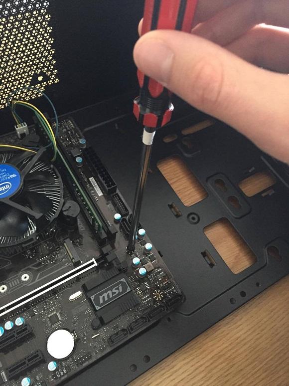 screw-motherboard-into-standoffs.jpg