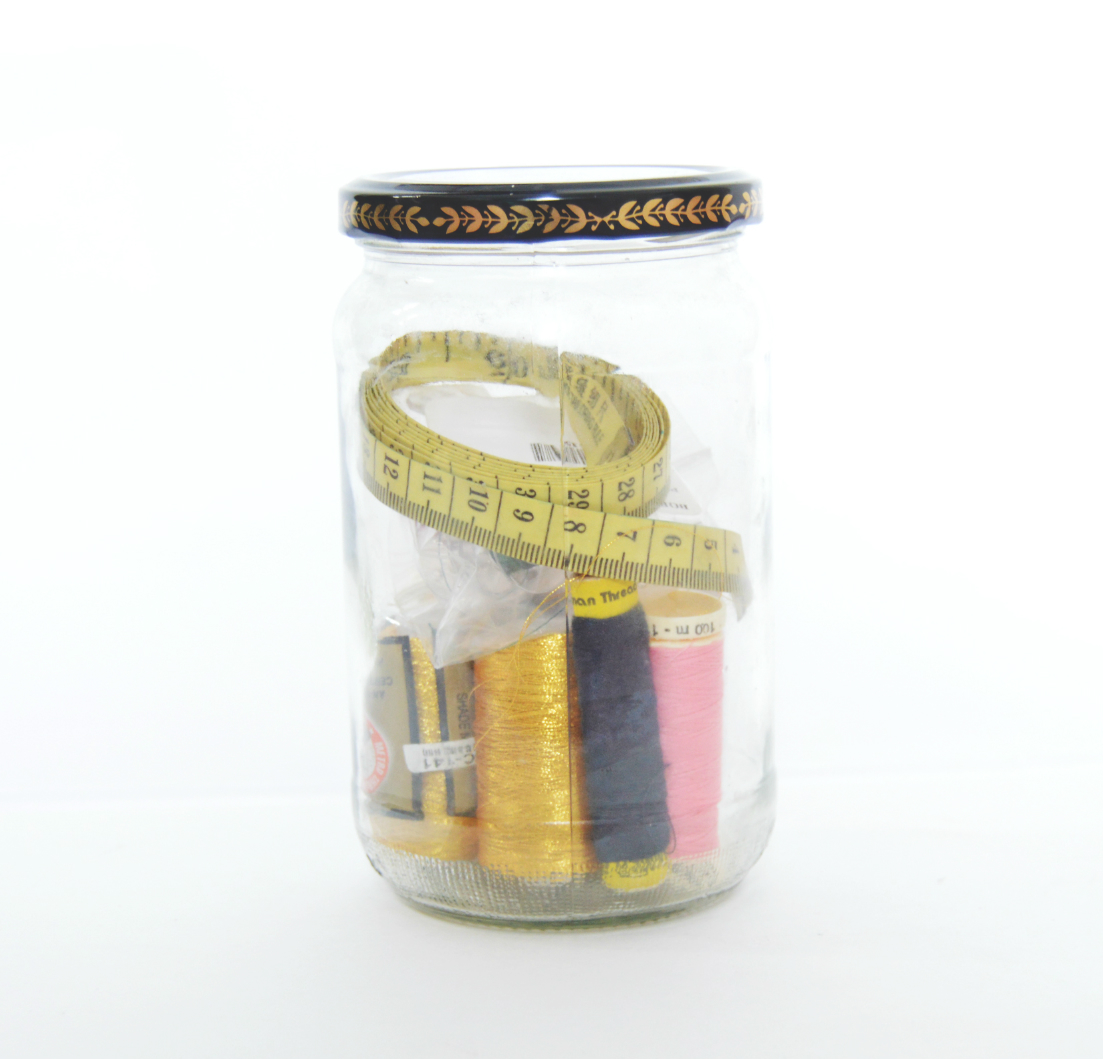 sewing supplies in glass containers.jpg