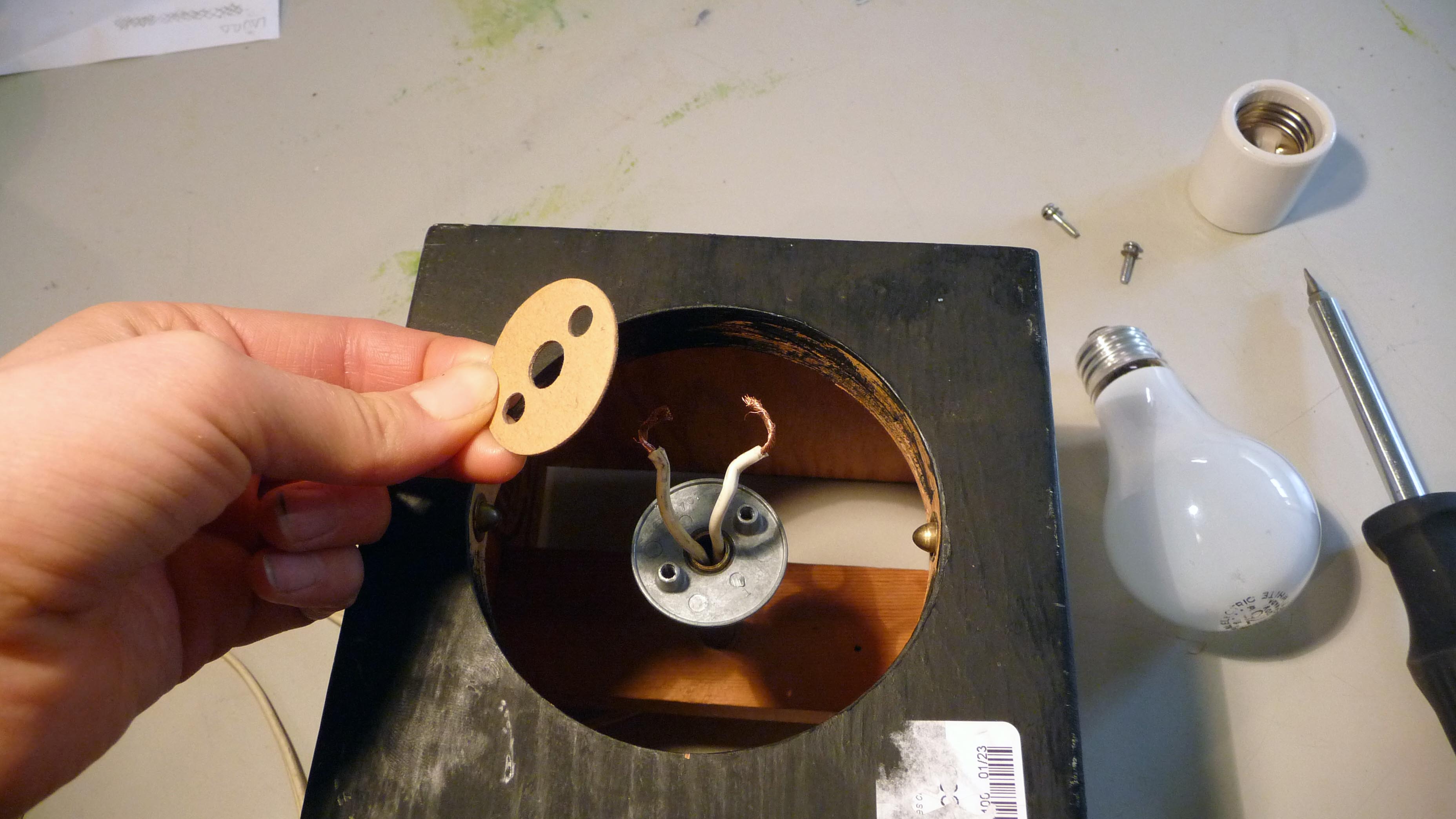 unscrew light bulb and cardboard piece.jpg