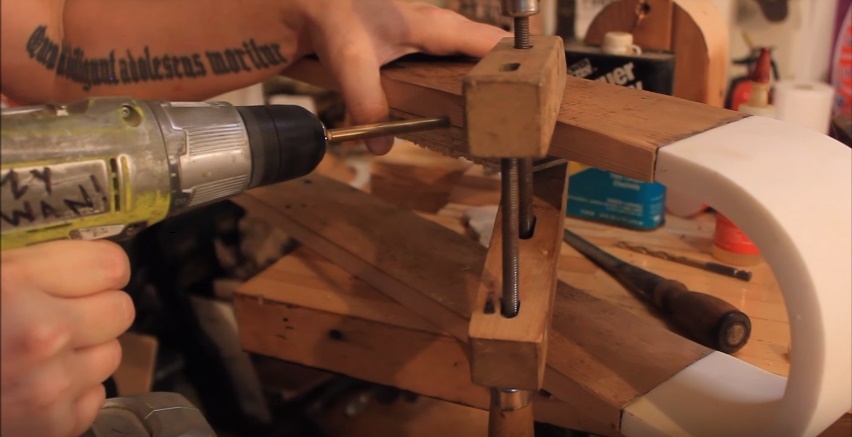 use a piece of plywood to drill a half channel into the back edge of the shelfs top underside.jpg