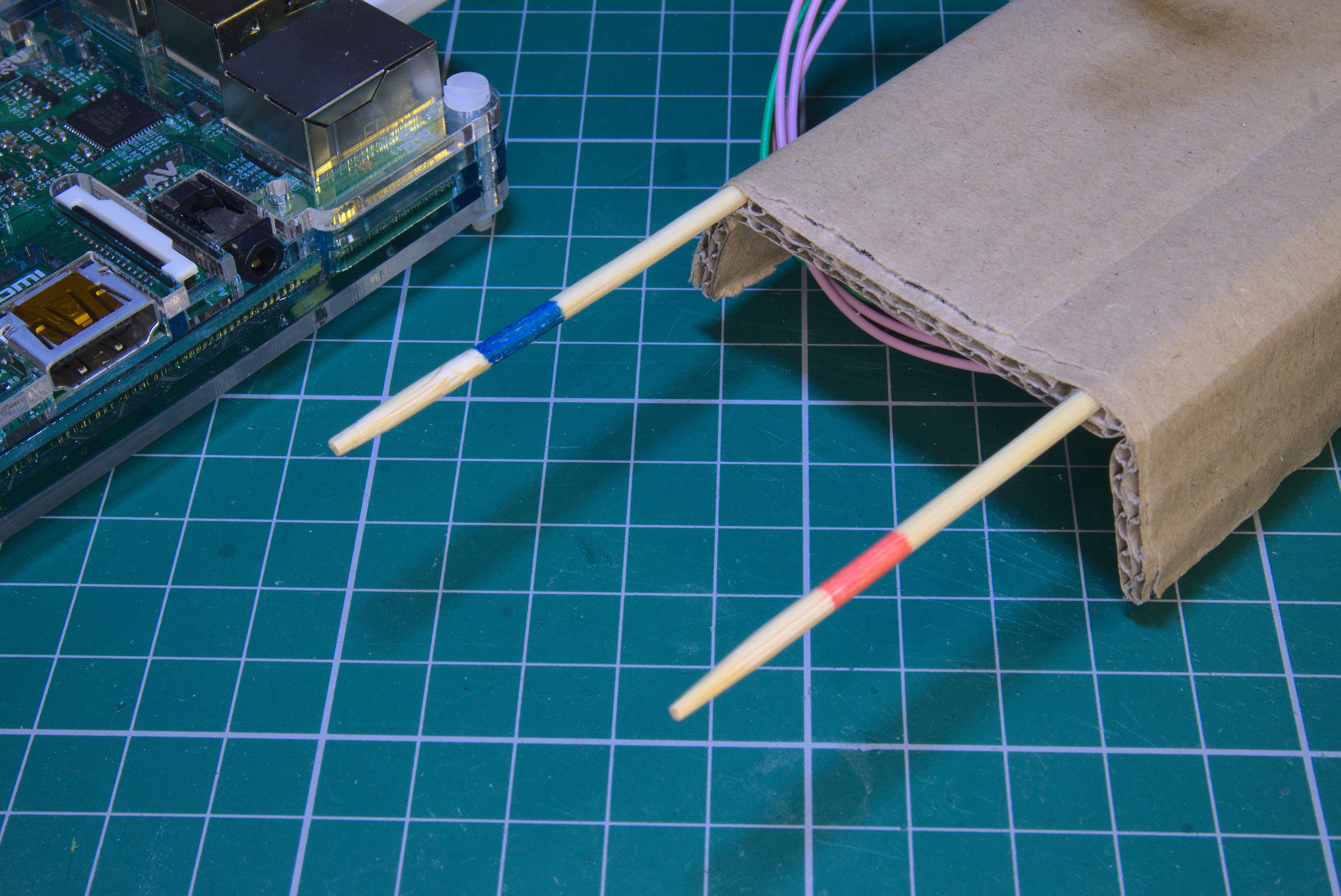 wooden_sticks_cardboard.jpg