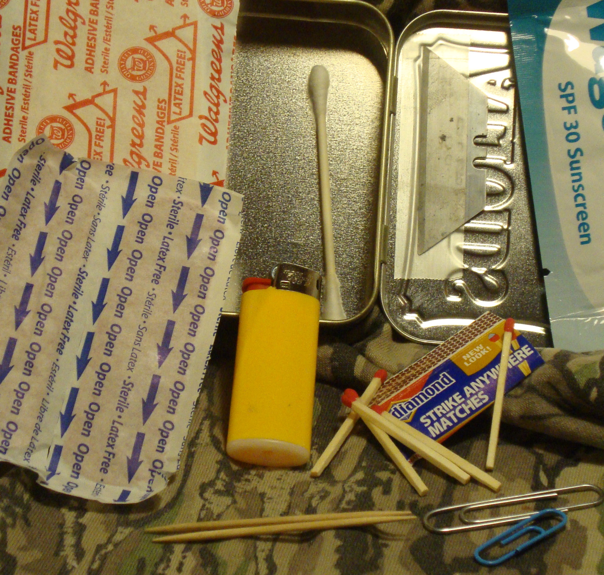 Altoids_Survival_Kit_Tin_Gear_Box_Bandaids_Sunscreen_Paper_Clips_Toothpicks_Matches_Lighter_Photo_Jack_Jobe.jpg