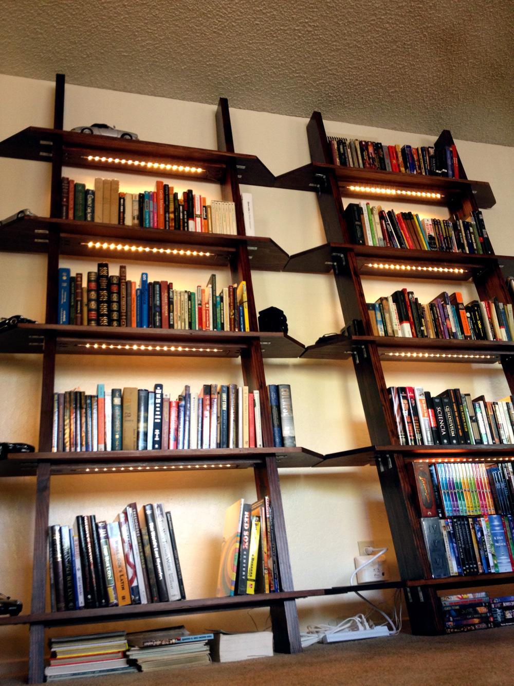 Leaning Bookshelves With LED Lighting