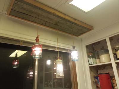 Over Sink Lighting Revamped Using Pallets and Old Kitchen Items