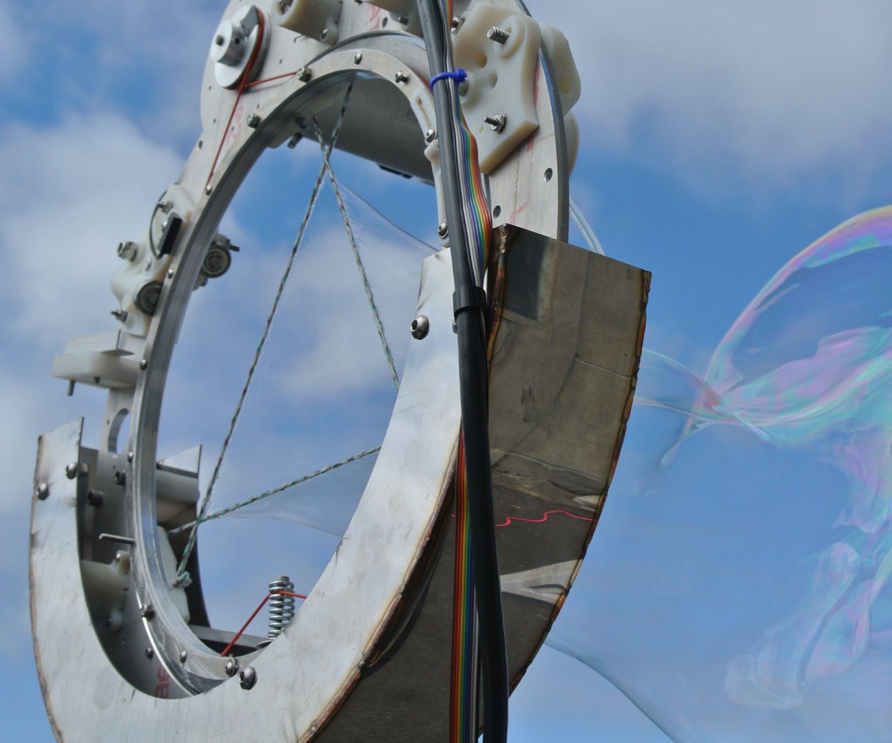 The CNC Bubble Iris:  a Computer Controlled Giant Bubble Machine