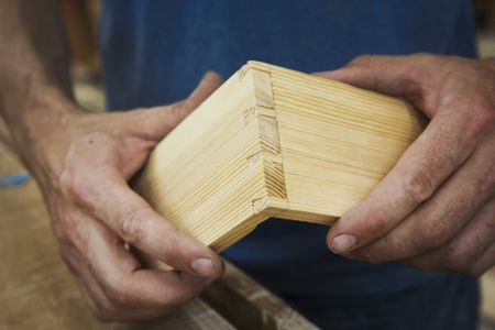 close-up-of-person-working-a-boat-builders-workshop--joining-together-two-pieces-of-wood--761604105-5a6b3320119fa800371affd8.jpg